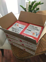 Box filled with copies of the book, Building Thinking Classrooms
